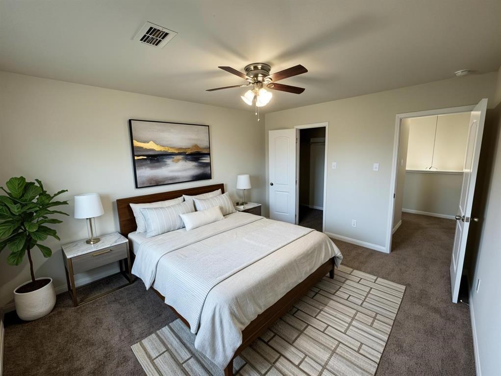 1318 Lucchese Lane Dallas, TX 75253 - Photo 19 of 25 a bedroom with bed and a chandelier