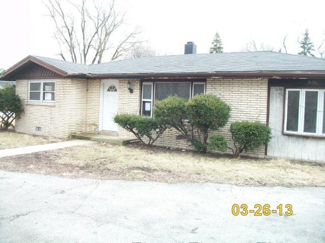 14300 Ridgeway Avenue Midlothian, IL 60445 - Photo 1 of 10 a front view of a house with garden