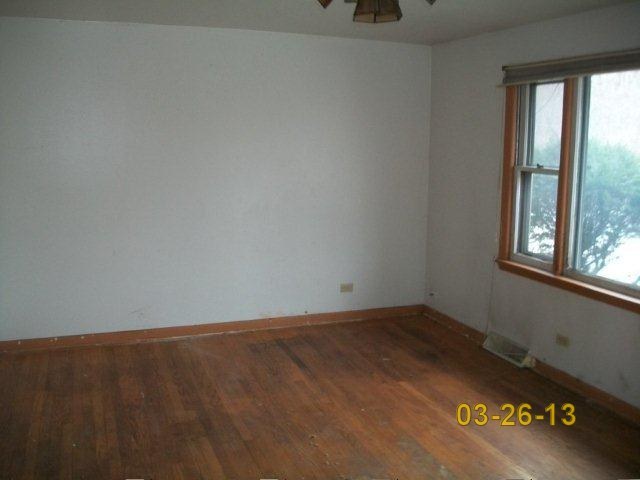 14300 Ridgeway Avenue Midlothian, IL 60445 - Photo 4 of 10 an empty room with a window