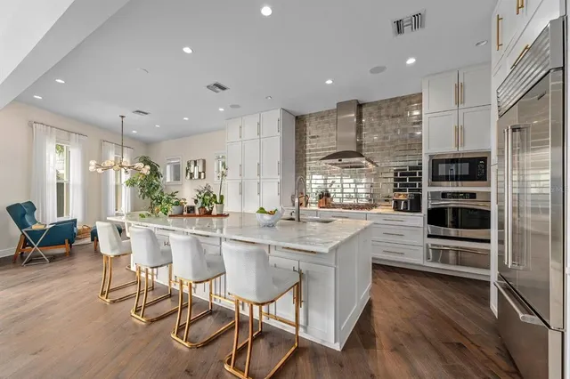 a living room with furniture and a large window with outer view