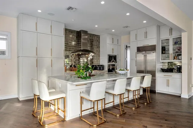 a view of a room that has a bed and a large window with garden view