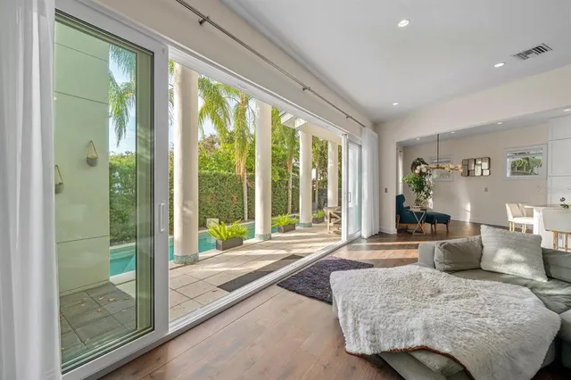 a view of an entryway with wooden floor and windows