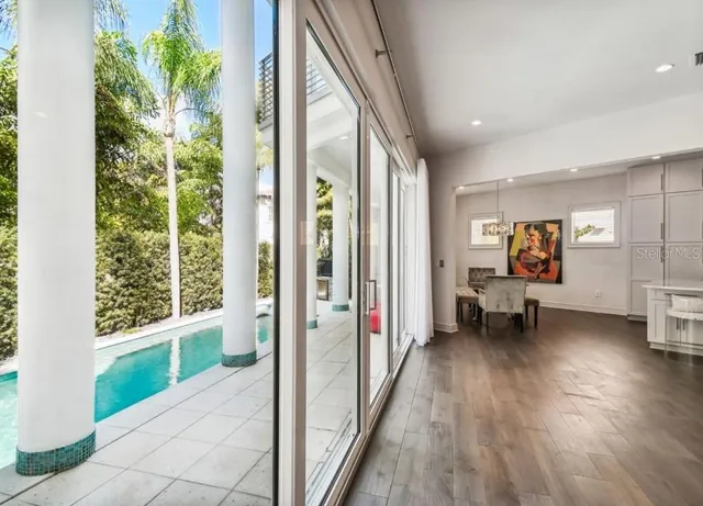 a view of an entryway with wooden floor and windows