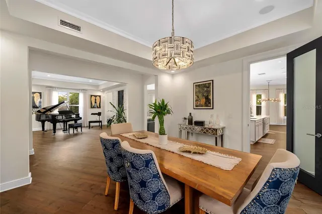 a living room with furniture and large windows