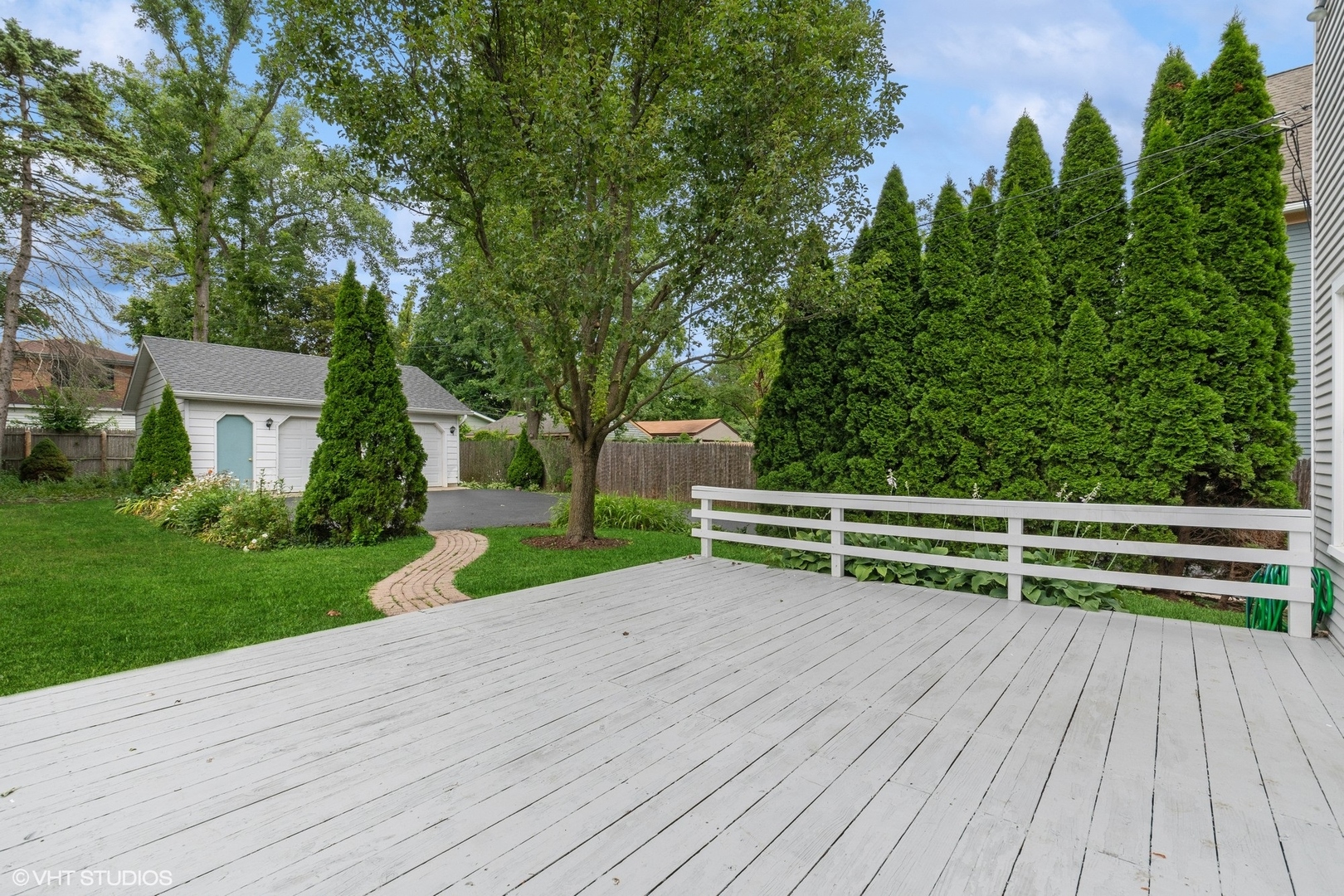 25 Washington Circle Lake Forest, IL 60045 - Photo 25 of 31 a view of a backyard with wooden fence