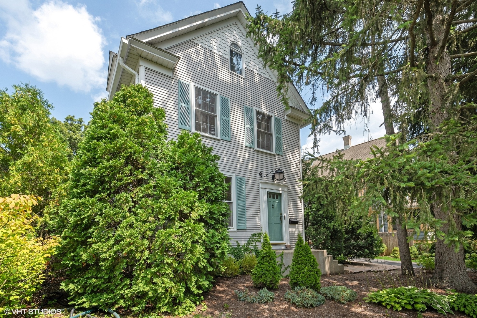 25 Washington Circle Lake Forest, IL 60045 - Photo 28 of 31 a view of a white house next to a tree