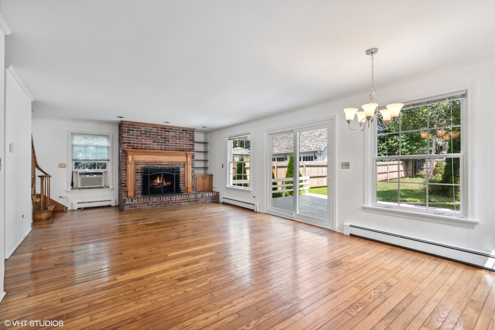 25 Washington Circle Lake Forest, IL 60045 - Photo 3 of 31 a view of an empty room with wooden floor and a window