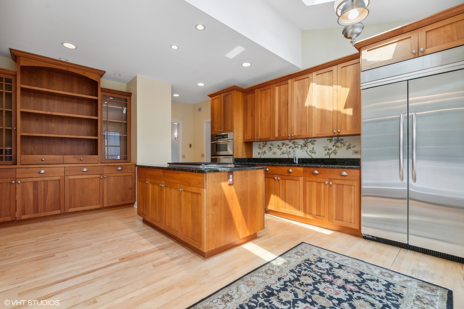 25 Washington Circle Lake Forest, IL 60045 - Photo 7 of 31 a kitchen with stainless steel appliances granite countertop a sink a stove and a refrigerator