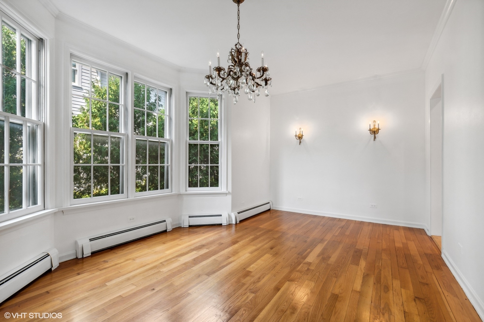 25 Washington Circle Lake Forest, IL 60045 - Photo 10 of 31 a view of an empty room with a window and wooden floor