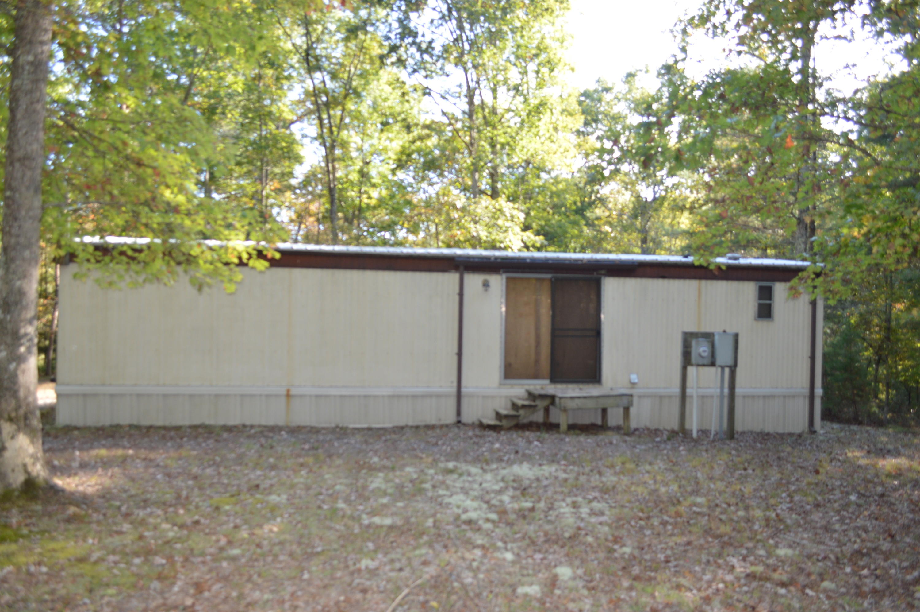 79 Davis Ridge Road New Castle, VA 24127 - Photo 3 of 7 a backyard of a house with barbeque oven