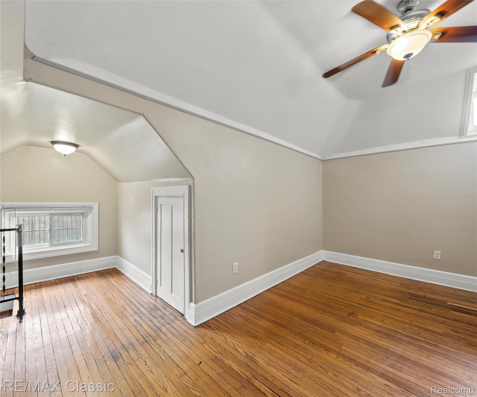 3941 Trumbull Detroit, MI 48208 - Photo 43 of 46 Attic room featuring hardwood flooring, sloped ceilings, and a ceiling fan with integrated lighting