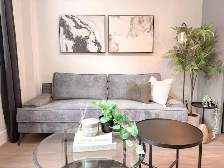 5317 Reiger Avenue, Unit 104 Dallas, TX 75214 - Photo 10 of 13 a living room with furniture and a potted plant