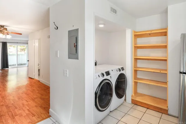 a view of a kitchen with refrigerator and washer