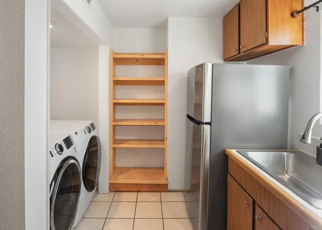 a stove top oven sitting inside of a kitchen