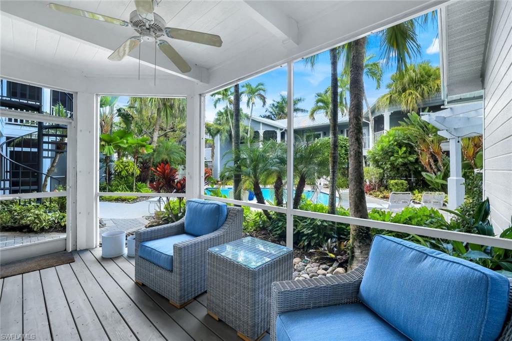 376 3rd Street South, Unit 102 Naples, FL 34102 - Photo 16 of 17 Sunroom featuring a ceiling fan and a deck