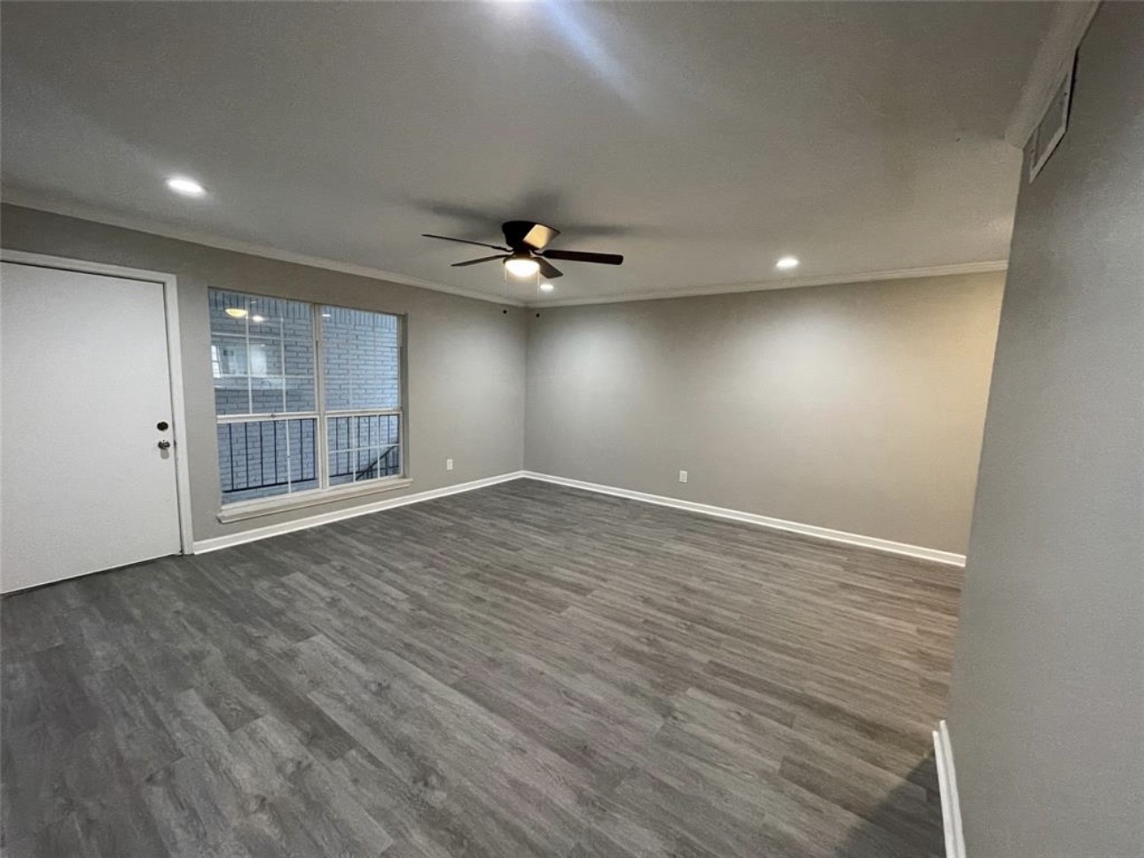 9711 Linkmeadow Lane, Unit 10 Houston, TX 77025 - Photo 5 of 27 a view of an empty room with a window