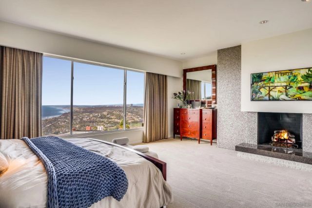 a bed sitting in a room next to a window