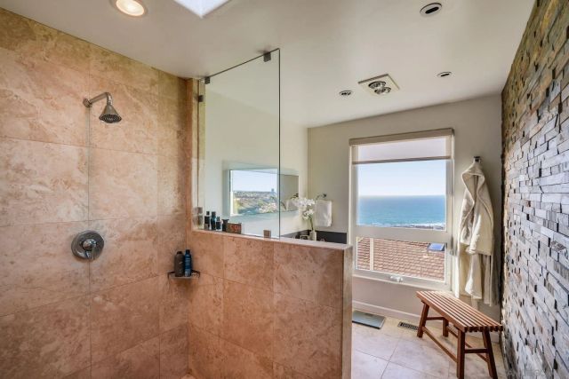 a bathroom with a bathtub and a shower