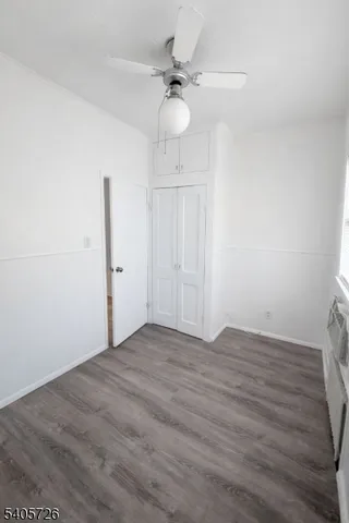 a view of a kitchen with a sink and a refrigerator