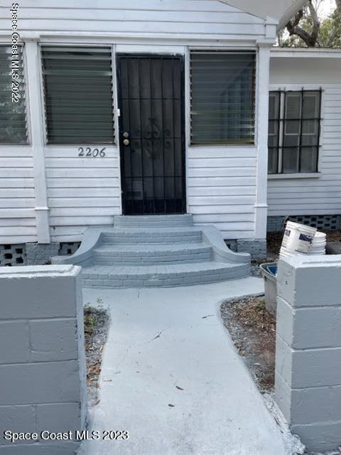 2206 Irwin Street Melbourne, FL 32901 - Photo 2 of 13 a view of entrance gate of the house
