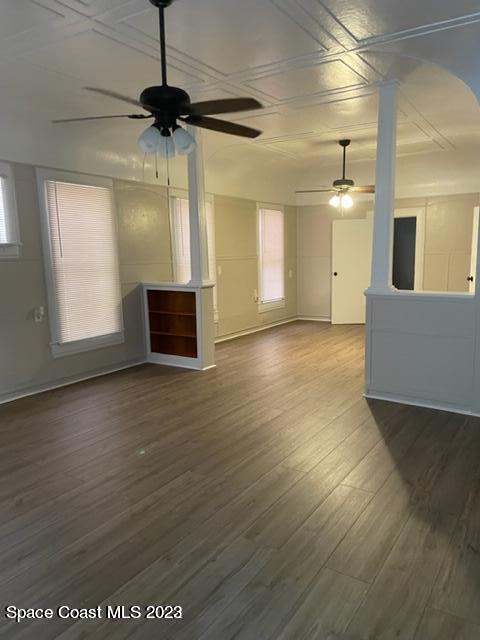 2206 Irwin Street Melbourne, FL 32901 - Photo 10 of 13 a view of a room with wooden floor ceiling fan and window