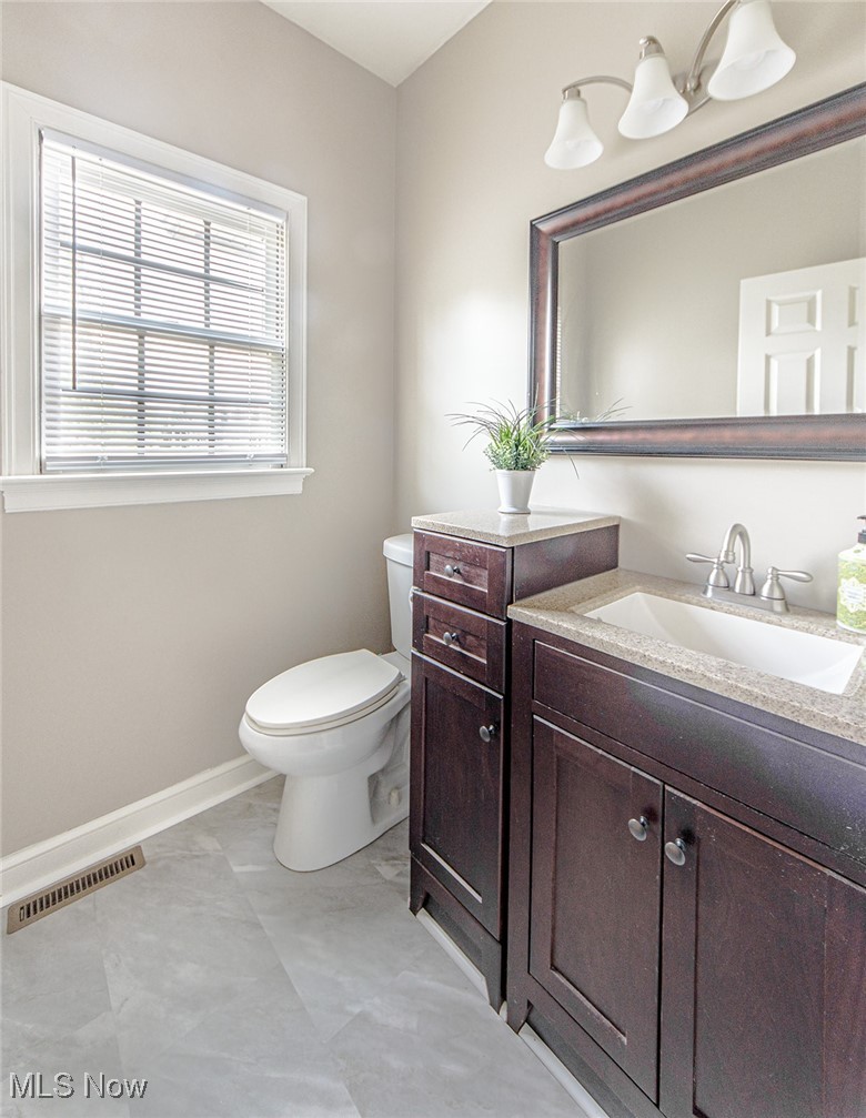 2394 Jacoby Road Akron, OH 44321 - Photo 18 of 45 Half bathroom on the first level with LVT flooring