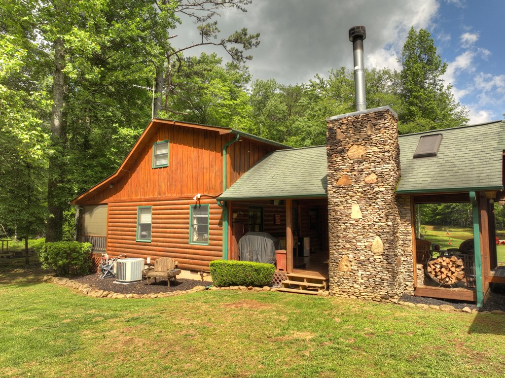 241 Dunn Mill Creek Road Blue Ridge, GA 30513 - Photo 73 of 97 a front view of a house with garden