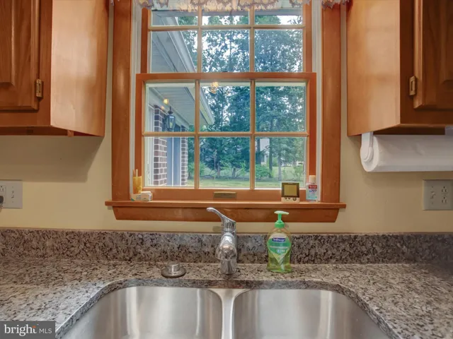 a kitchen with a sink and a window