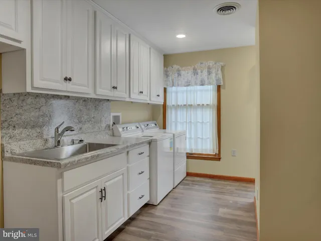a kitchen with cabinets and sink