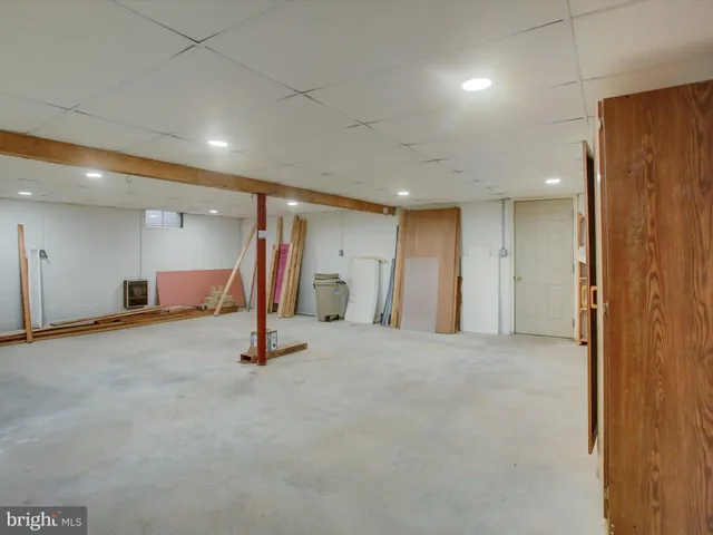 a front view of house with yard and trees