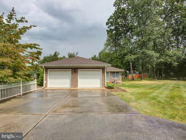 a swimming pool with outdoor seating and yard