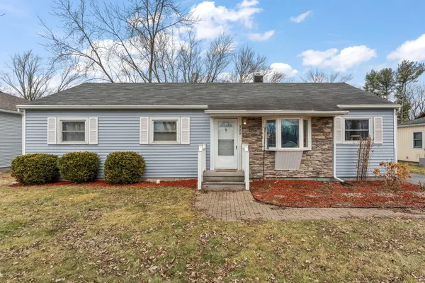 a view of a house with a yard