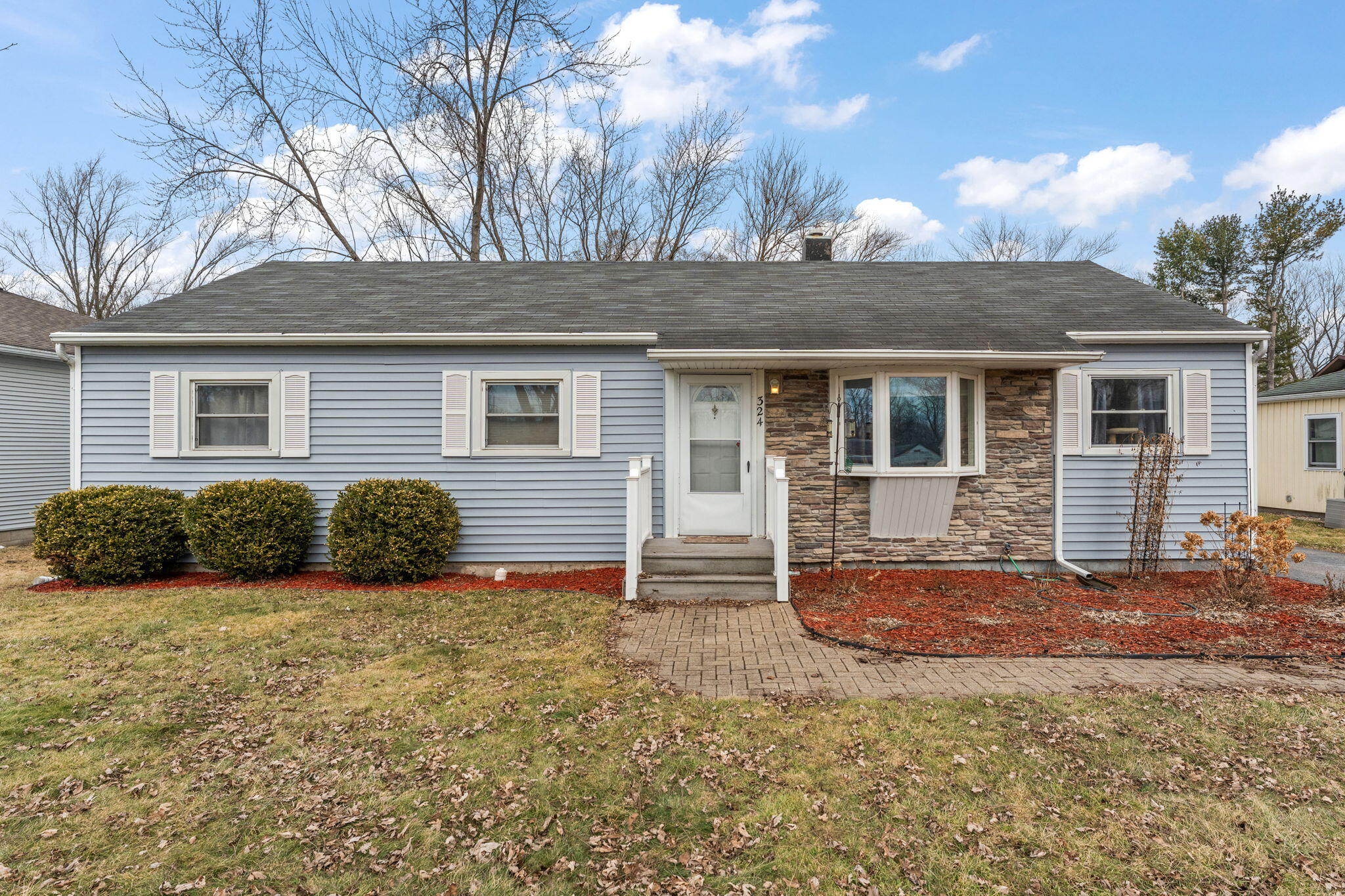 a view of a house with a yard
