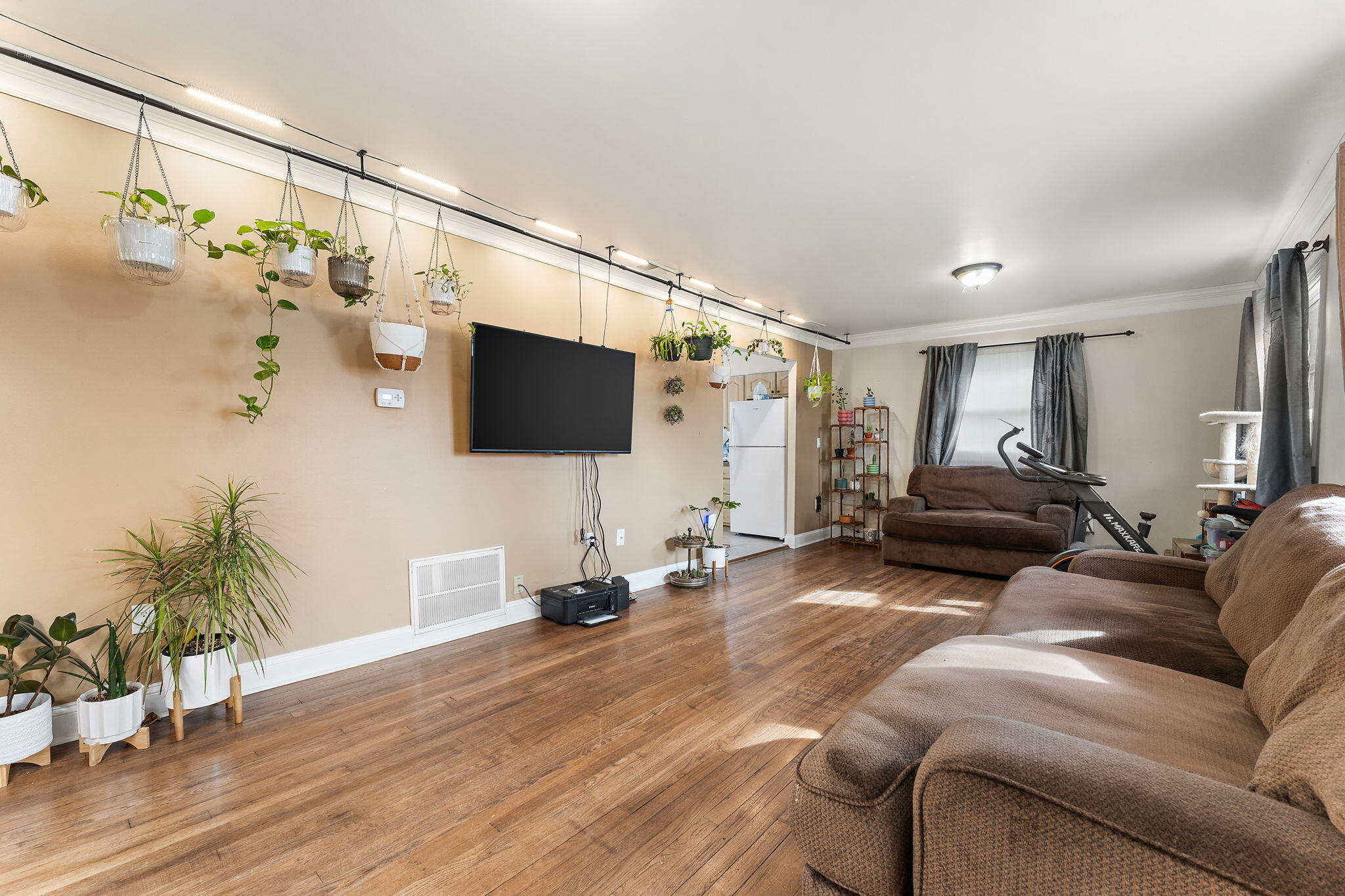 324 Maple Street Crown Point, IN 46307 - Photo 2 of 13 a living room with furniture and a flat screen tv