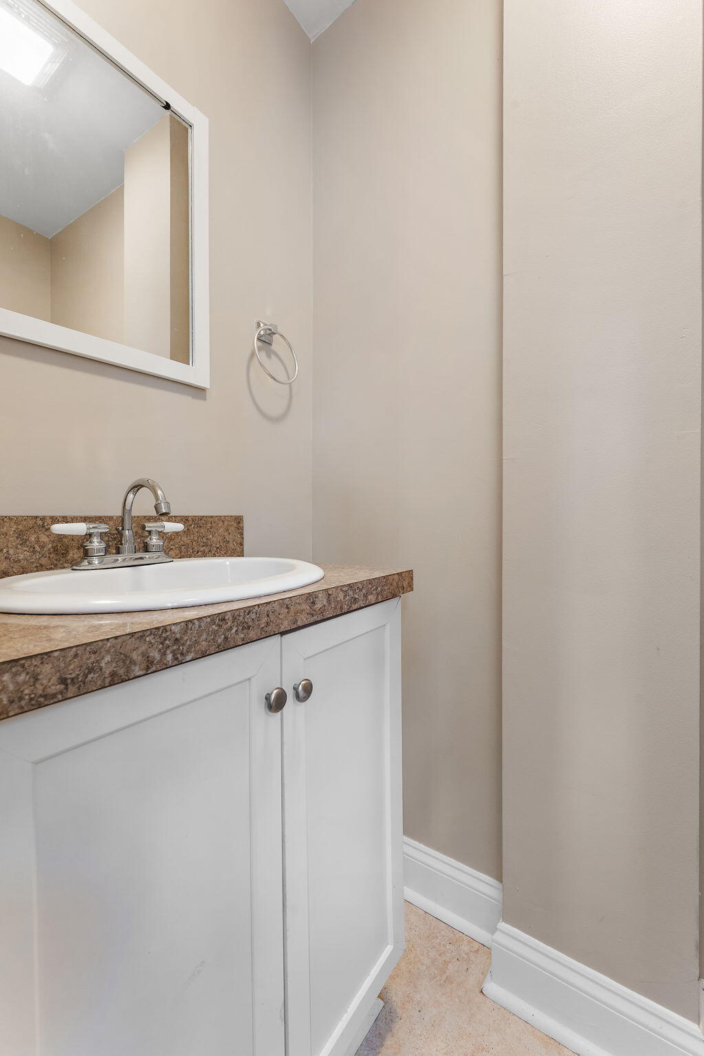 324 Maple Street Crown Point, IN 46307 - Photo 7 of 13 a bathroom with a granite countertop sink and a mirror