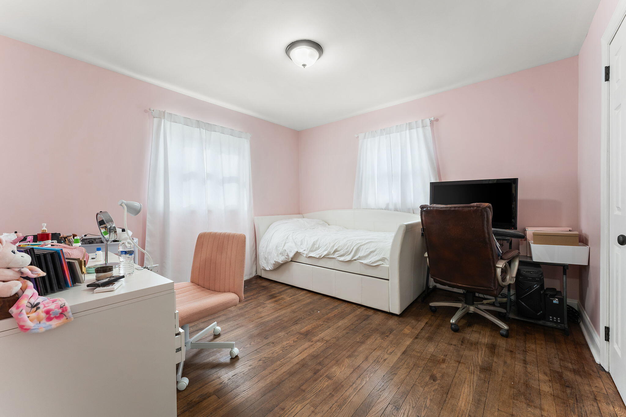 324 Maple Street Crown Point, IN 46307 - Photo 8 of 13 a bedroom with a bed and a chair
