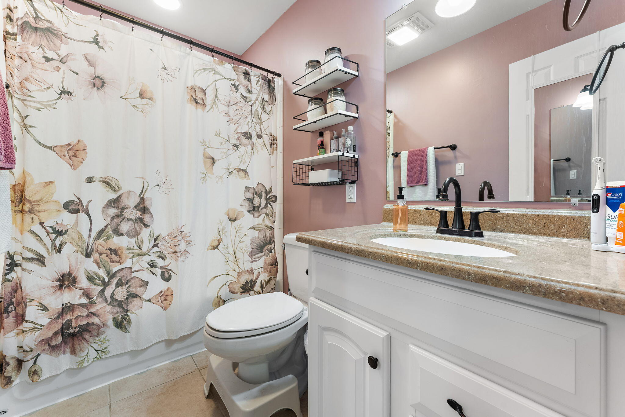 324 Maple Street Crown Point, IN 46307 - Photo 9 of 13 a bathroom with a sink toilet and shower