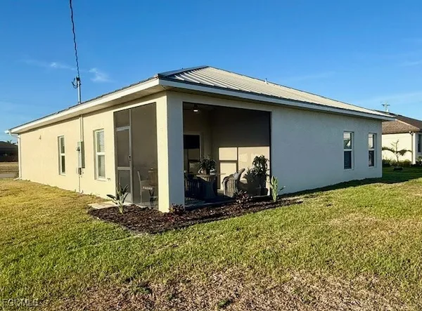 a view of front door and yard