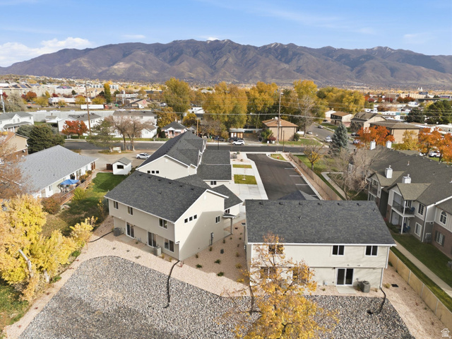 1627 North Angel Street Layton, UT 84041 - Photo 21 of 39 Aerial view of residential area featuring a mountainous background