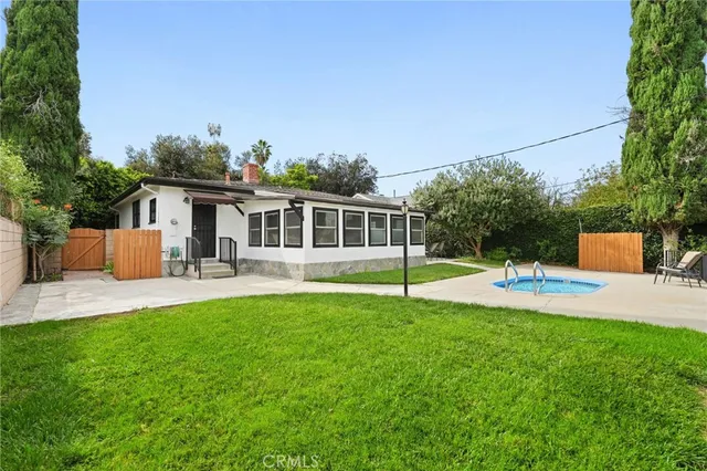 a bathroom with a toilet and a mirror