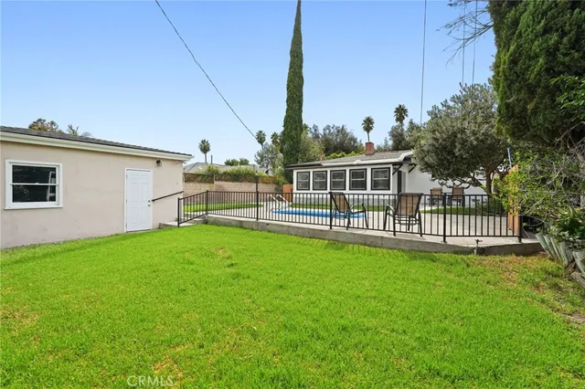 an aerial view of multiple houses with outdoor space