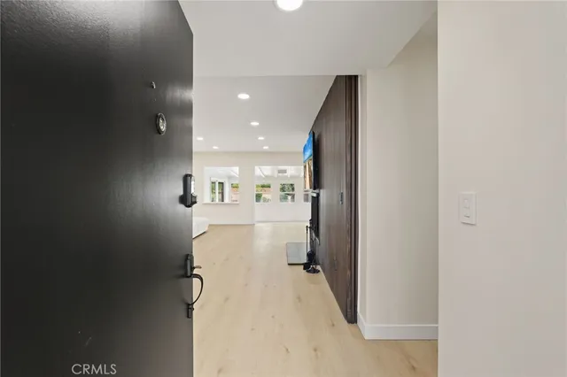 a kitchen with stainless steel appliances granite countertop a stove a refrigerator and a microwave