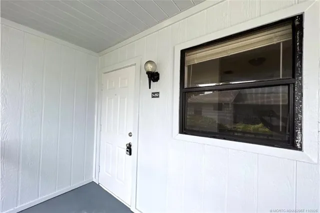 a silver refrigerator freezer and a sitting space
