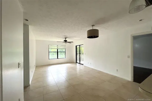 a view of empty room with windows