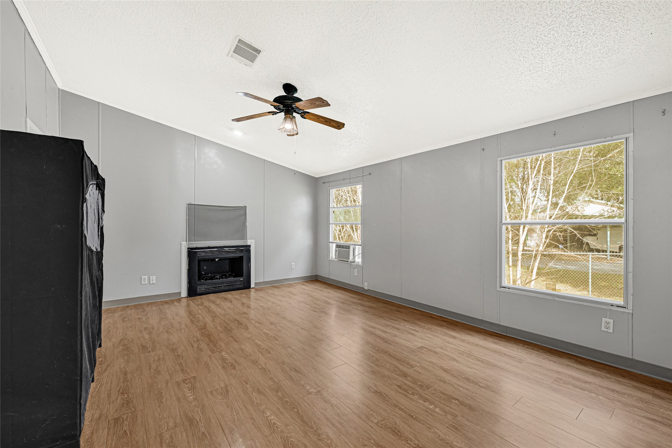 3725 Allen Road Pearland, TX 77584 - Photo 14 of 43 a view of empty room with wooden floor and fan
