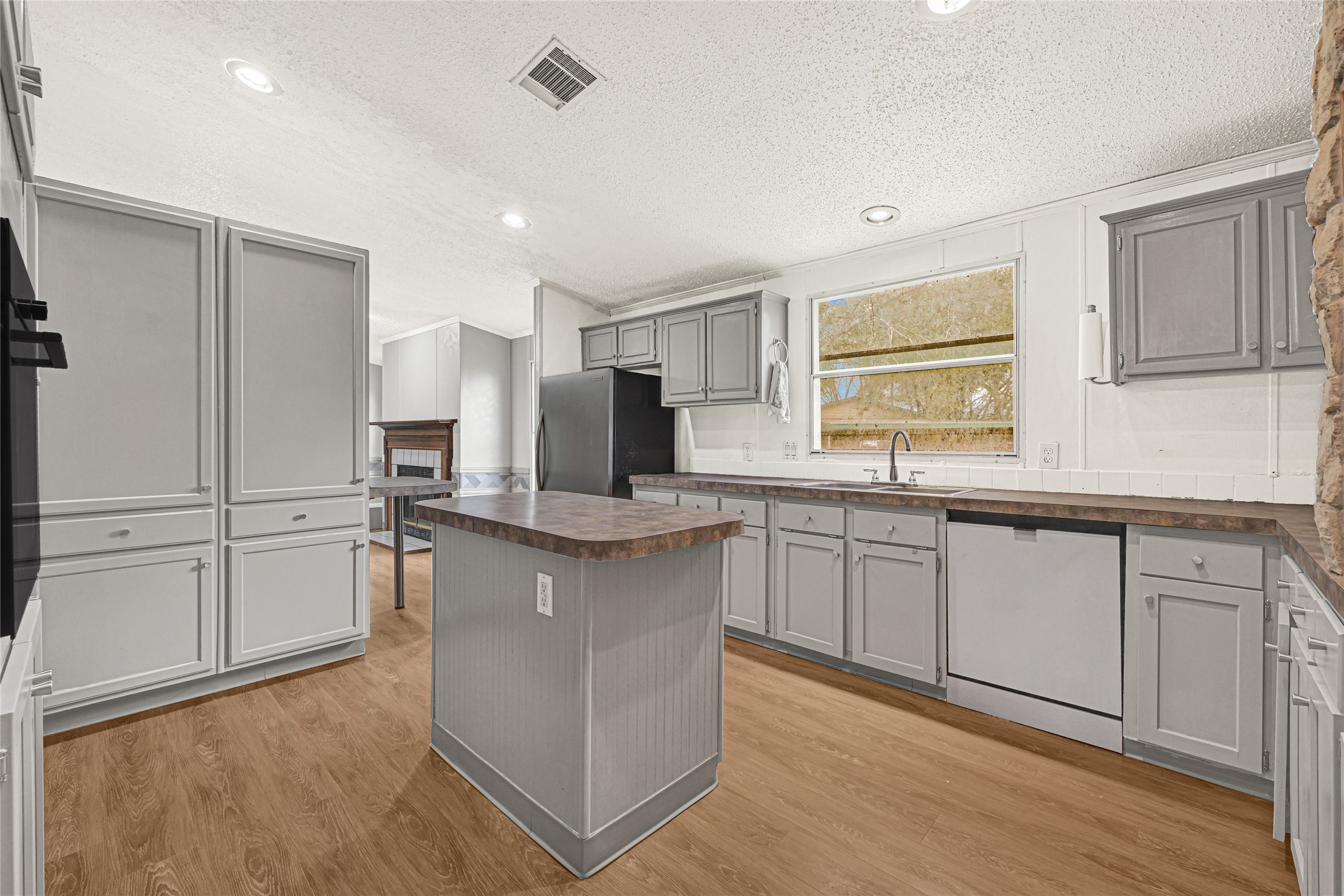 3725 Allen Road Pearland, TX 77584 - Photo 17 of 43 a kitchen with stainless steel appliances granite countertop a stove a sink and a refrigerator