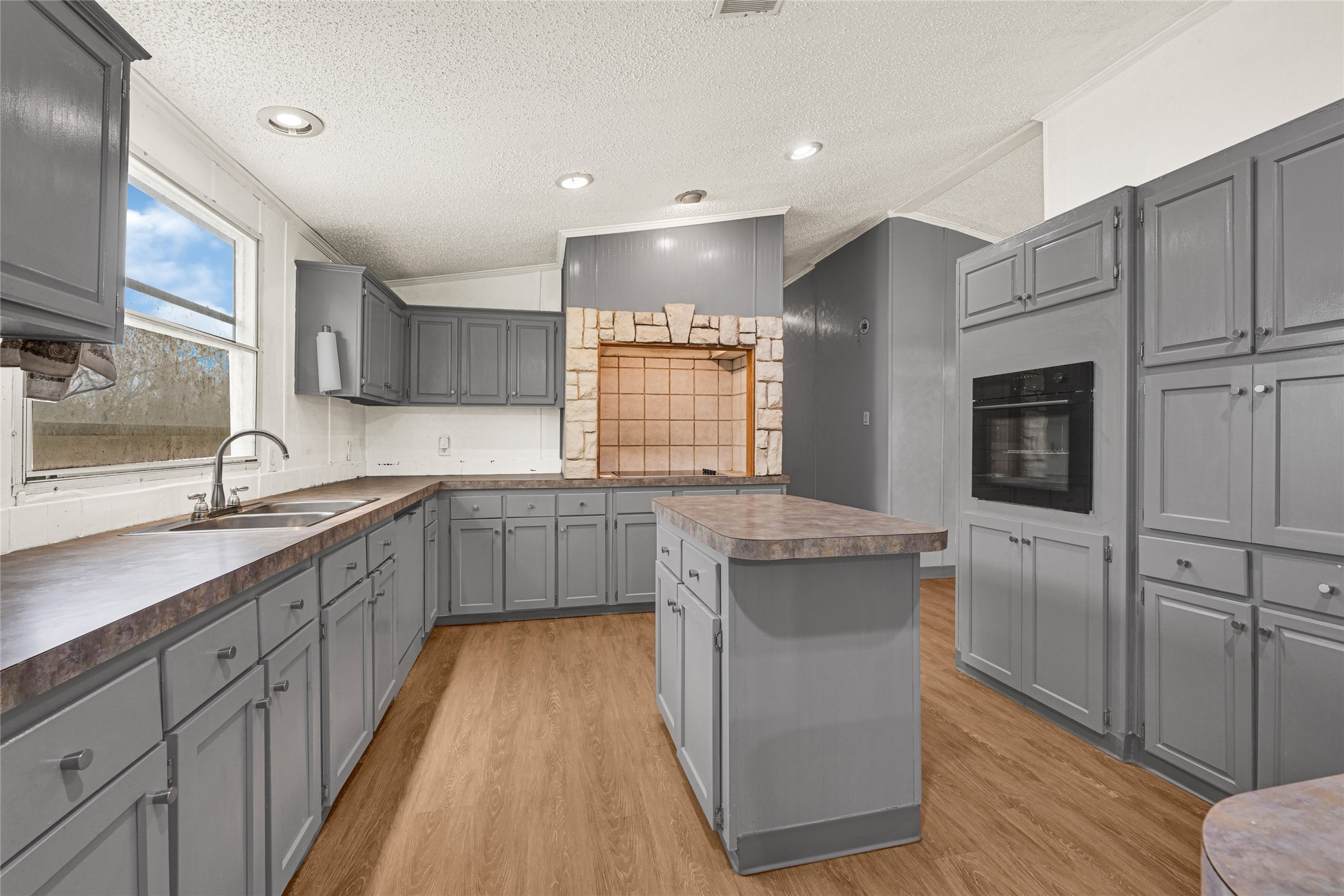 3725 Allen Road Pearland, TX 77584 - Photo 19 of 43 a kitchen with a sink cabinets stainless steel appliances and a window