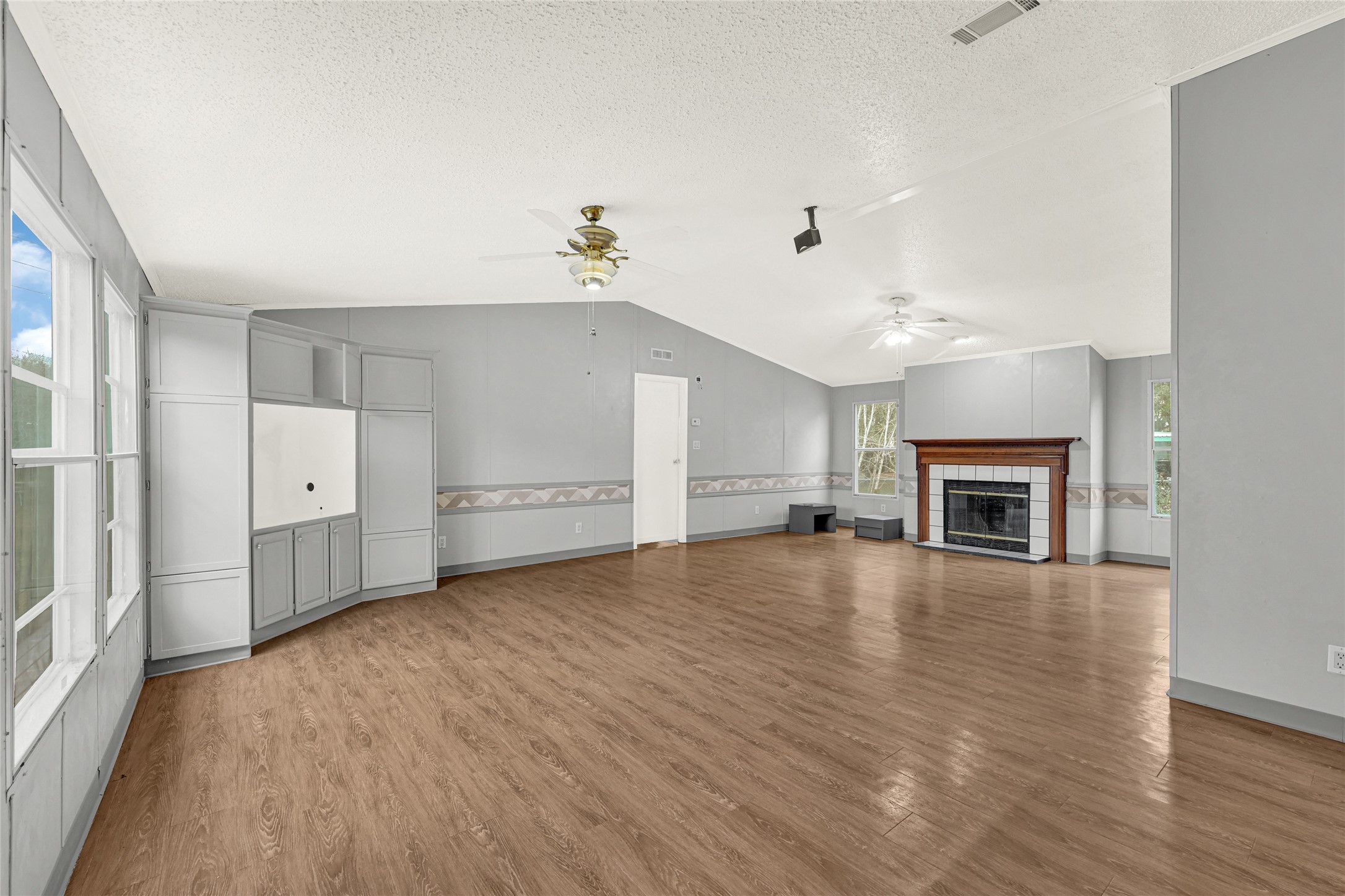 3725 Allen Road Pearland, TX 77584 - Photo 24 of 43 wooden floor in an empty room with a fireplace