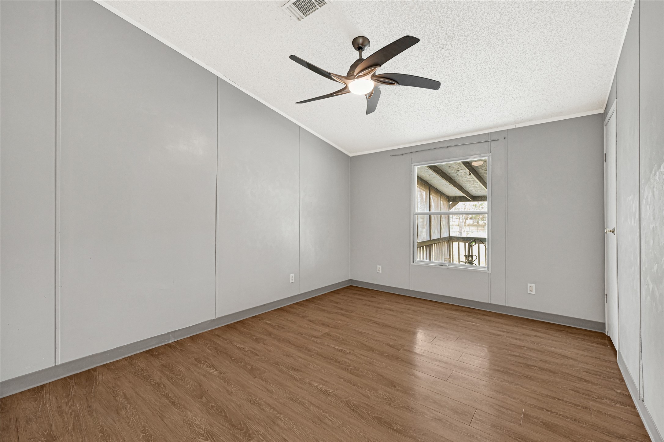 3725 Allen Road Pearland, TX 77584 - Photo 5 of 43 wooden floor in an empty room with a window