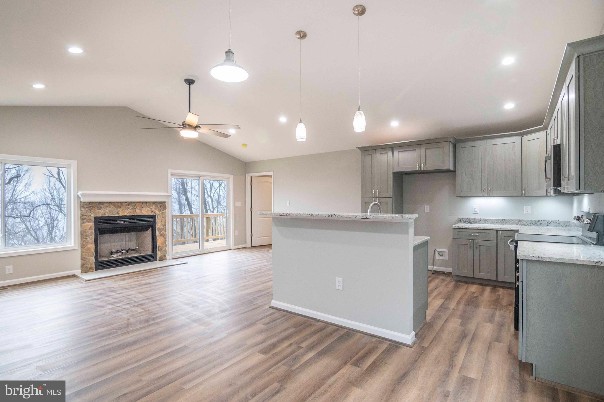571 Wilderness Road Linden, VA 22642 - Photo 14 of 48 a view of kitchen with cabinets and wooden floor
